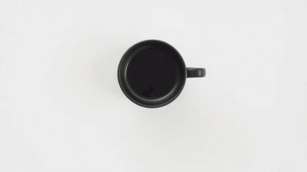 Minimalist cup of black coffee on white background, coffee atrial fibrillation
