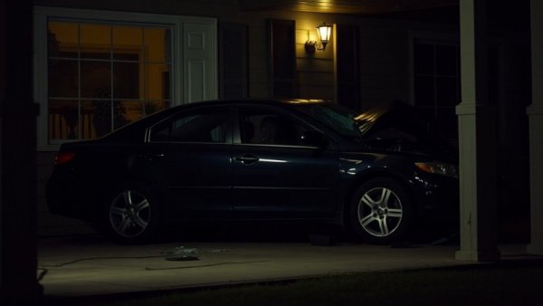 Fatal porch crash in San Antonio: car in porch at night scene
