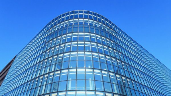 Modern building with glass facade related to health data interoperability.