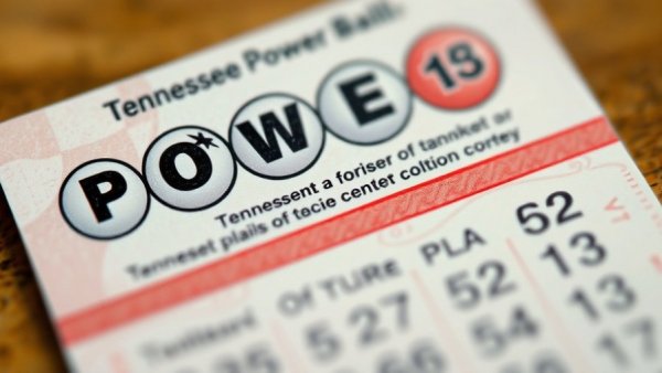 Close-up of Tennessee Powerball lottery ticket in red and gray.