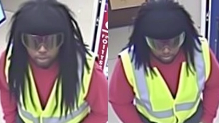 Portrait of a serious young man posing against a plain background.