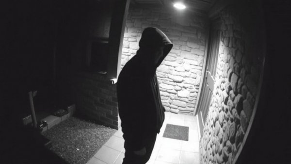 CCTV footage of unidentified person on porch related to Nancy Guthrie's disappearance.