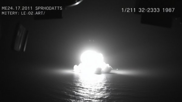 US military action against Iranian assets captured in a grainy night shot.