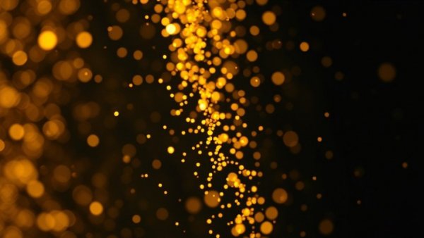 Dynamic vibrant golden particles in motion, dark background.