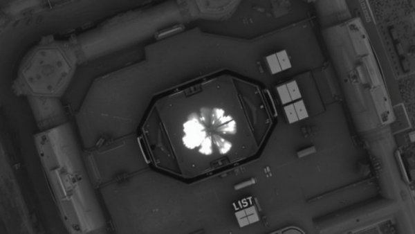 Aerial thermal view of military infrastructure destruction.