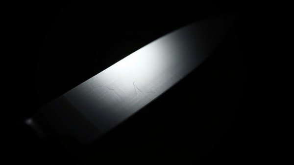 Kitchen knife in the dark, dramatic low-key lighting.