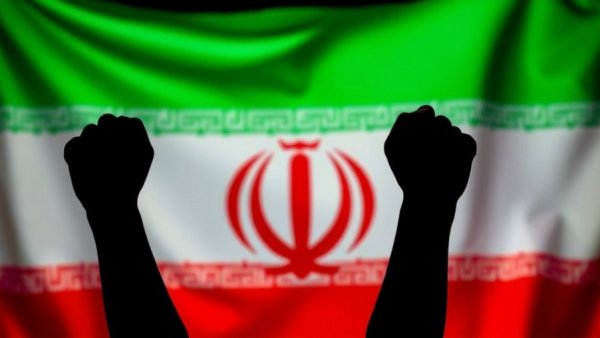 Silhouetted fists raised against Iranian flag backdrop symbolizing protest.