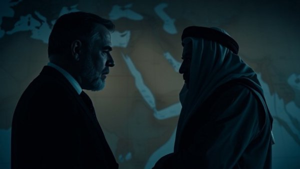 Negotiations with Iran depicted with silhouetted figures against a map.