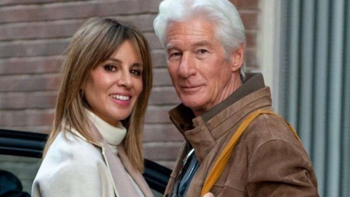 Richard Gere and younger wife during a family celebration, sharing cultural experiences in Spain.