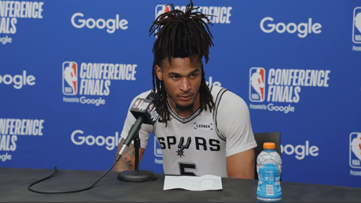 San Antonio sports news featuring Spurs player in action on the court.