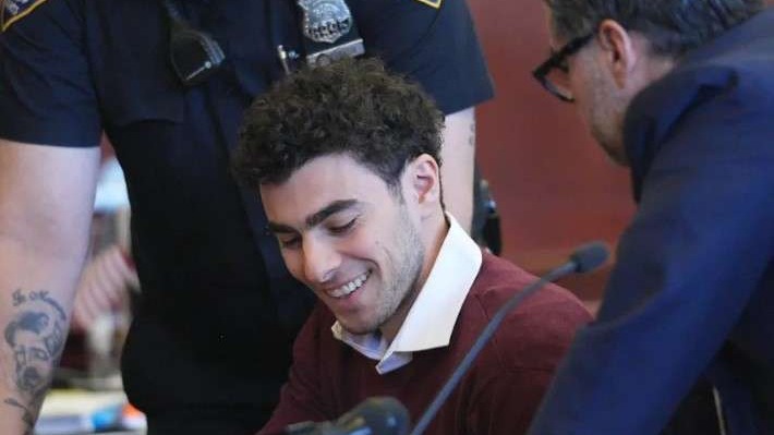Young man amidst law enforcement in urban setting, illustrating vigilante justice modern America.