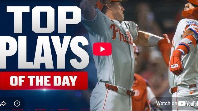 Phillies vs. Angels players celebrating in game action, dynamic scene.
