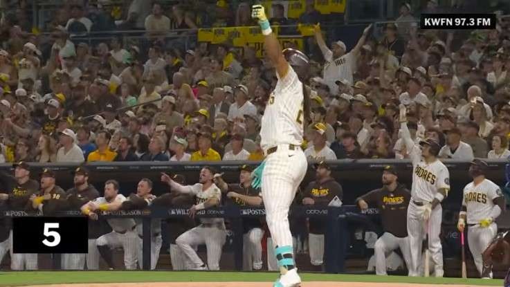 Top 5 MLB plays during postseason game with player and crowd.