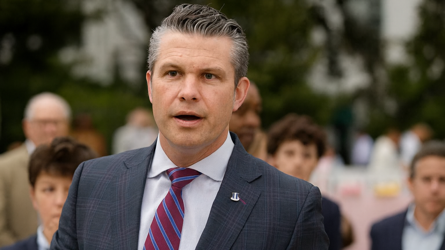 Speaker at podium discussing higher military physical standards.