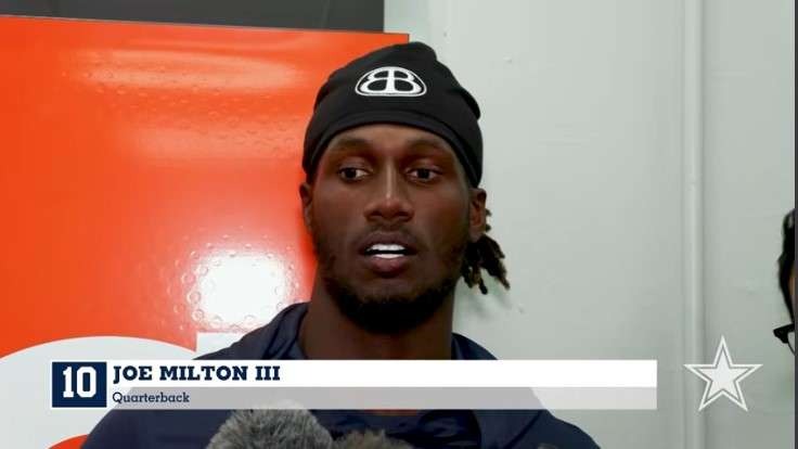 Young athlete smiles during a press interview after Dallas Cowboys preseason victory.