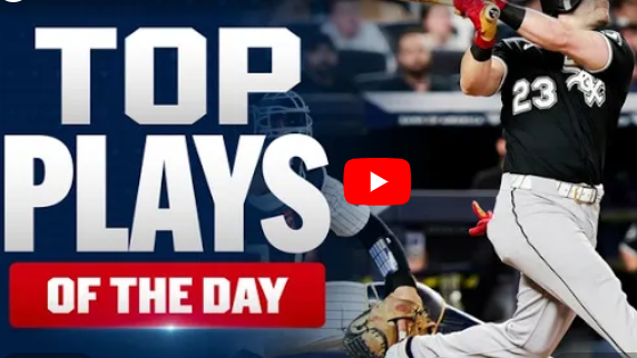 Andrew Benintendi's Grand Slam: Baseball player mid-swing in action.