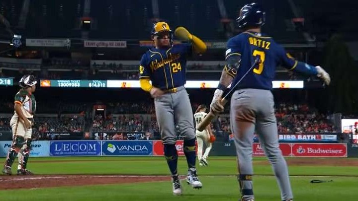 Braves players celebrate clinching postseason spot.