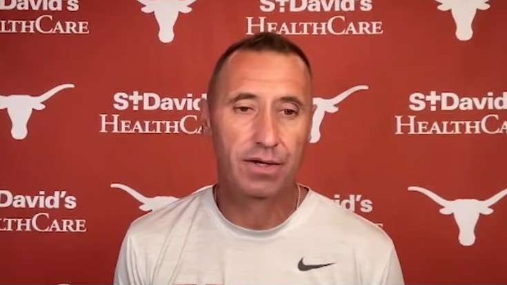 Texas Longhorns Goosby news interview with backdrop logos.