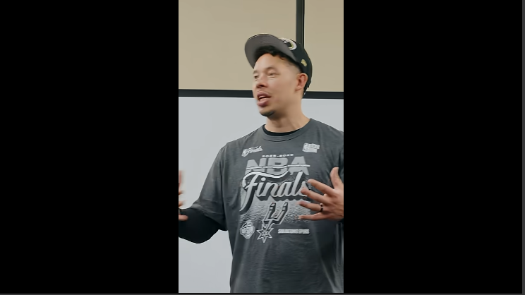 San Antonio sports fan in Spurs NBA Finals shirt speaking.