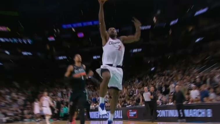 Kawhi Leonard in Los Angeles jersey dribbling during a game