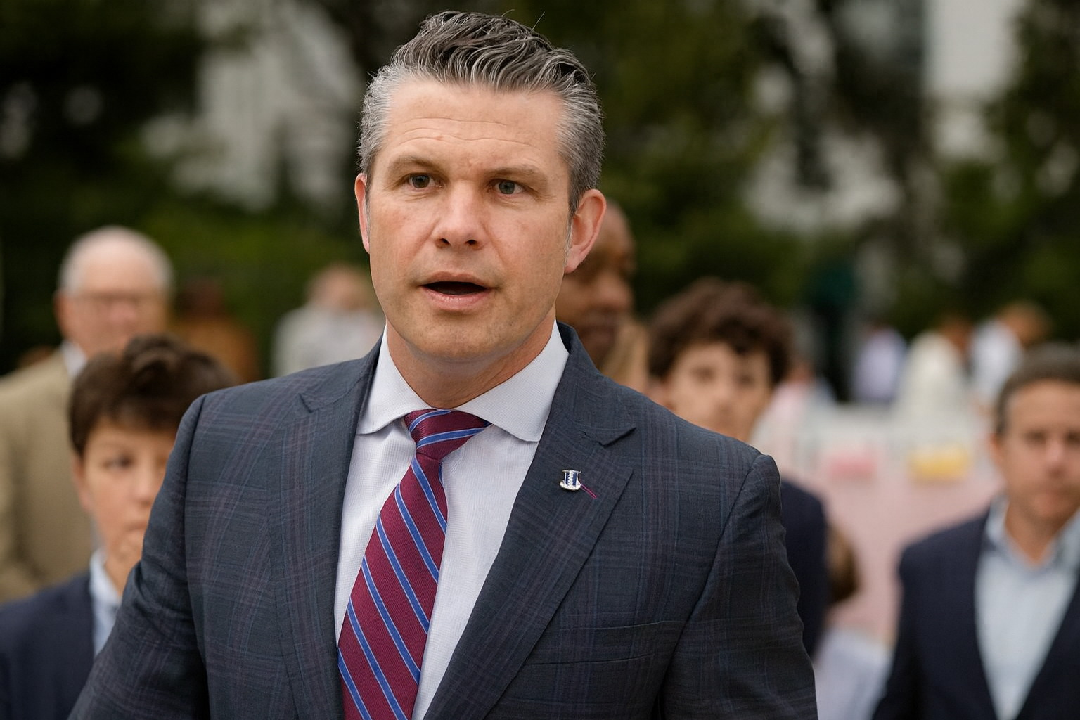 Confident man in blue suit in elegant hallway, representing leadership.