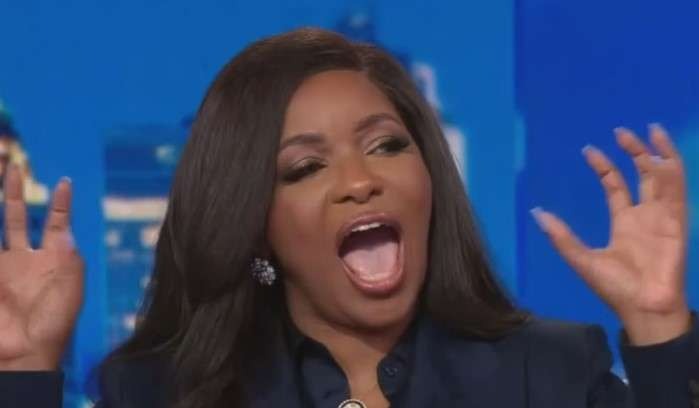 Confident woman speaking during Texas Senate race event, outdoors.