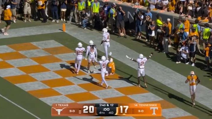 Texas Longhorns vs. Tennessee Volunteers football player celebrating win.