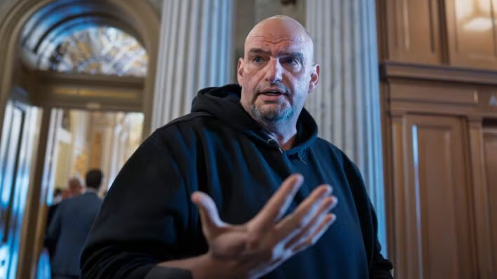 Contemplative Senator's thoughtful pose in national news setting.