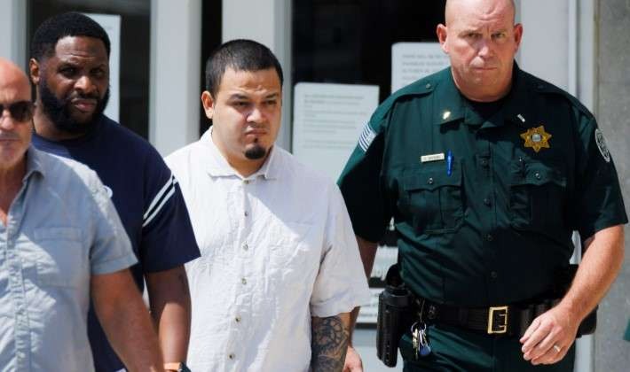 Close-up of Kilmar Abrego Garcia amid a crowd, highlighting ICE custody news.