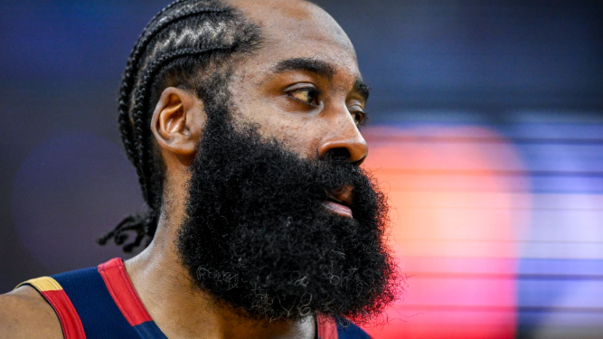 Male athlete in hoodie speaking to media, James Harden arrested context.