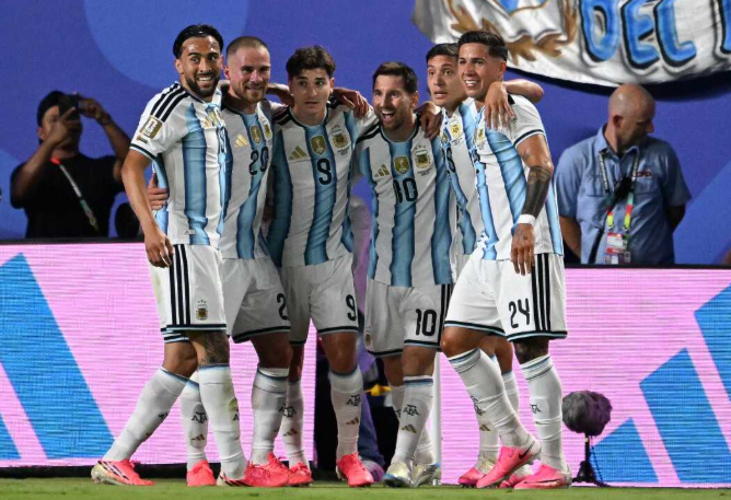 Messi World Cup hat trick celebration on the soccer field.