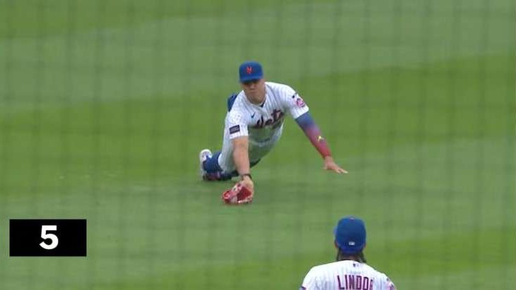 Baseball player celebrates key play, MLB Grand Slam Highlights.