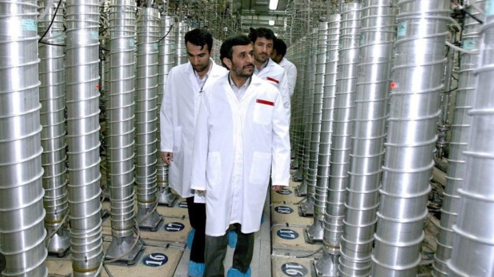 US news articles in a Fox News broadcast with flags and commentator.