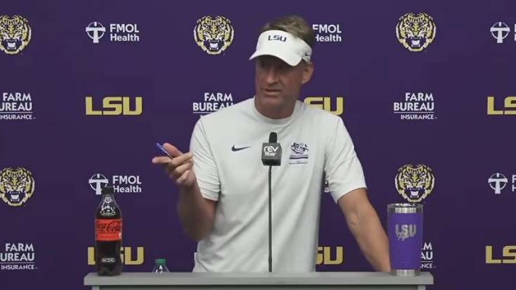 LSU Football Press Conference text on purple background with helmet.
