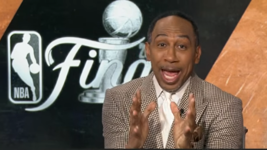 Focused Spurs player featured in sports analysis discussing Spurs season performance.
