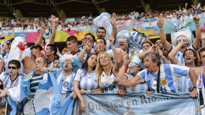 Argentine Soccer Fans: Man in Adidas cap at event.