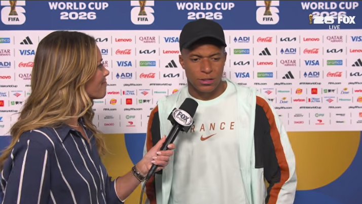 Kylian Mbappé discusses Spain football tactics in a press setup.