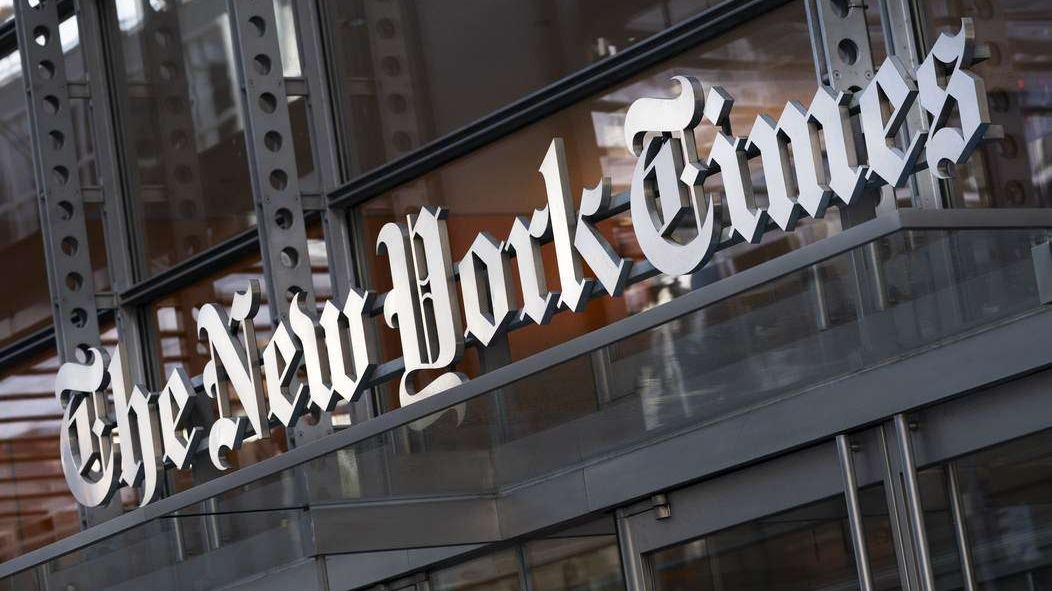 Billboard portraying older man over US flag, exploring media coverage.