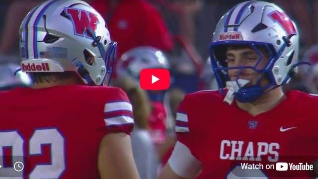 Westlake vs Englewood High School football players discussing strategy.