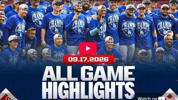 Dodgers NL West Championship team celebration in blue shirts.