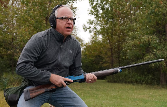 Close-up of two men in a heated discussion depicting Trump's criticism of Tim Walz.