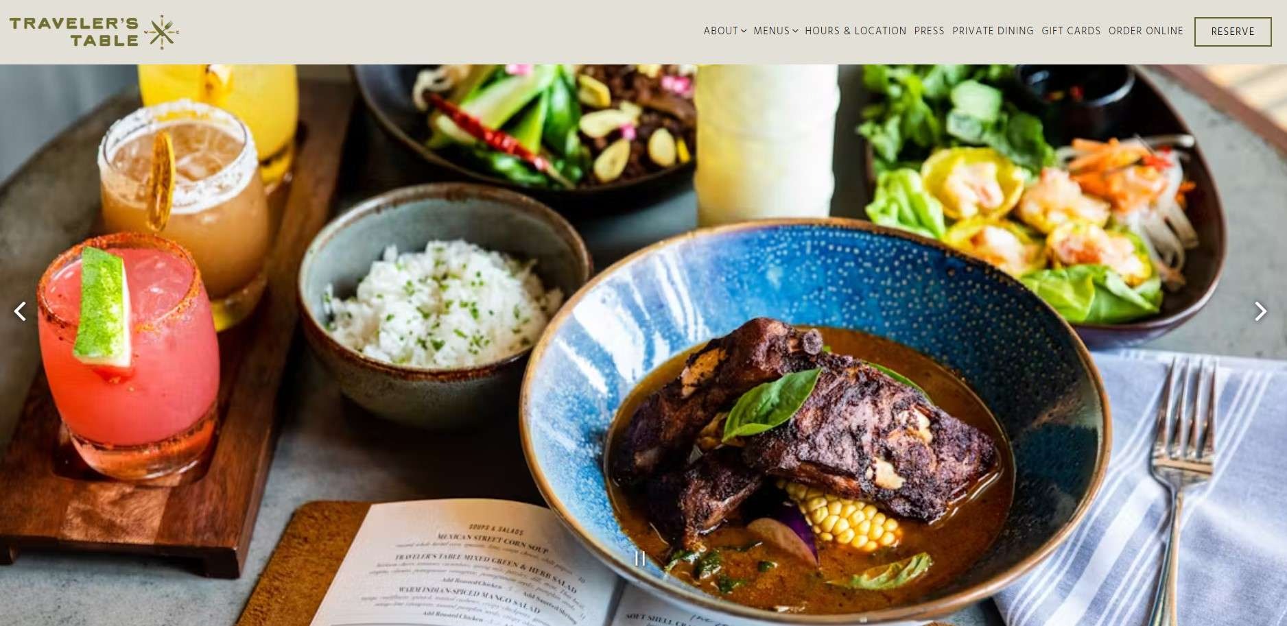 Logo depicting compass with fork and knife for global cuisine in Houston.