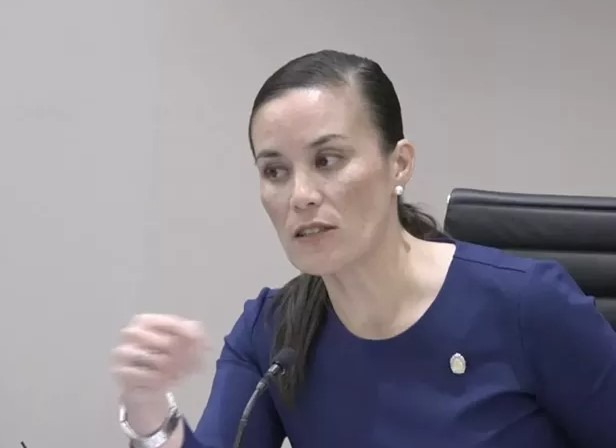 Hispanic woman addressing San Antonio entrepreneurs, highlighting local economy growth.