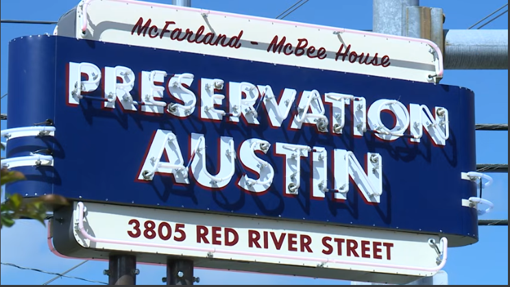 Preservation Austin sign for 2026 Homes Tour, vibrant retro style.