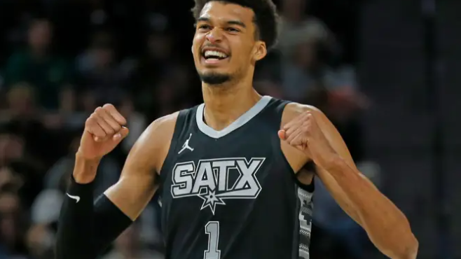 San Antonio Spurs player celebrates top play in highlights.