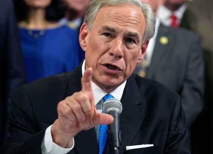 Serious man in a suit, representing San Antonio abortion travel fund context.