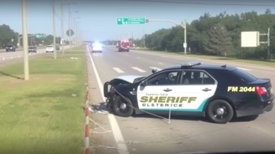 Traffic safety highlighted by Galveston County sheriff's damaged patrol vehicle on FM 2004.