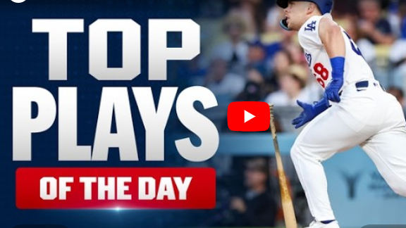 Baseball player swinging bat in game, energetic action shot.