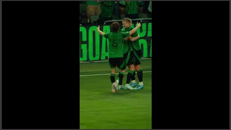 Mikkel Desler Banger: Soccer players celebrate goal in stadium.