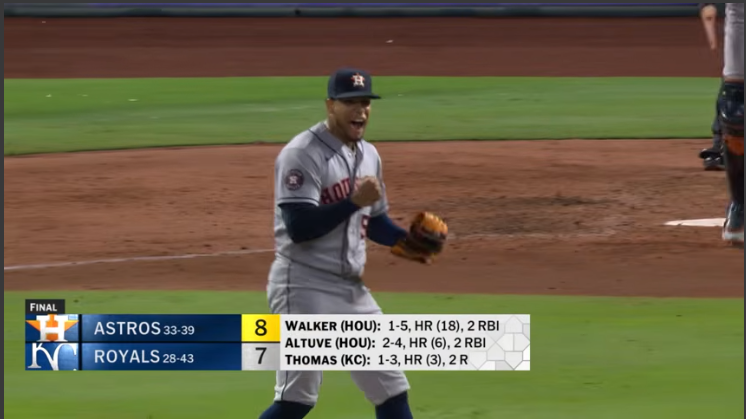 Astros vs. Royals game highlights with player sliding into base.